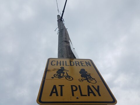 Yellow Children At Play Sign On Telephone Pole