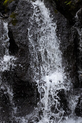 Close up of waterfall. Dynamic water flow. Waterscape background. Nature and environment concept. Pucak Manik waterfall Bali, Indonesia