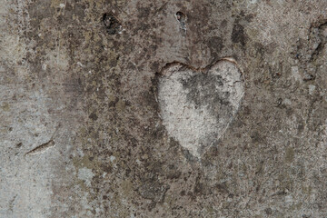 The shape of a heart on a concrete wall
