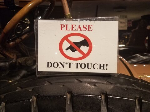 Please Don't Touch Sign On Old Automobile Parts