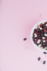 raw beans in a cup on the background