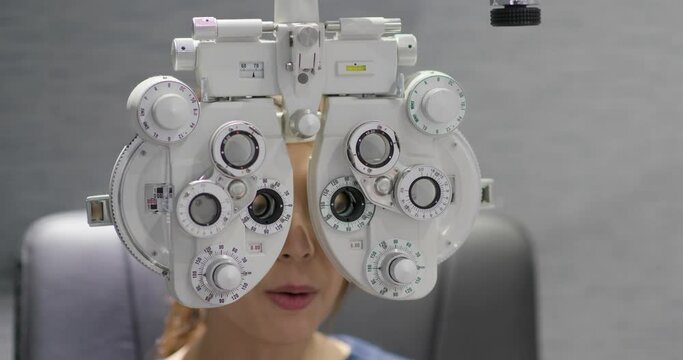 Woman check her eye in clinic