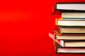 stack of books on red background