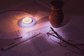 The workplace of a modern astrologer. Accessories of an astrologer. Printouts of computer...
