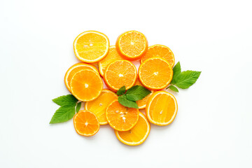 Orange slices grouped center of frame on white desk