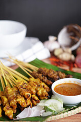 Satay is a popular Malaysia / Indonesia dish of seasoned, skewered and grilled chicken and meat, served with peanut sauce.
