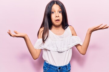 Beautiful child girl wearing casual clothes clueless and confused with open arms, no idea and doubtful face.