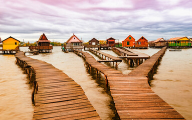 pontoon over the lake with holiday cottages