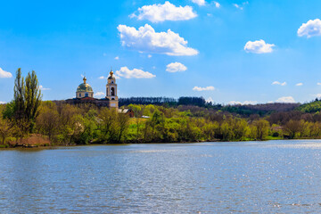View of the beautiful lake and old orthodox church on a shore