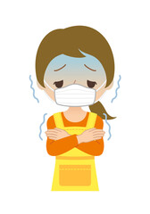 マスクとエプロンをした体調不良で悪寒がする主婦