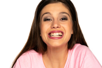 Young beautiful woman showing her healthy teeth