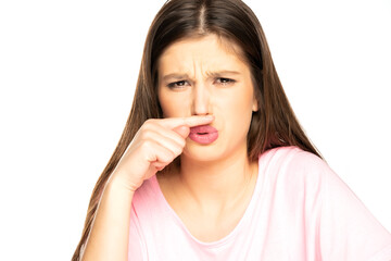 young woman with bad smell gesture