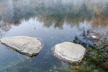 Beautiful morning fog or smoke over Huay mak leam hot spring, Lam Nam Kok National Park, Thailand