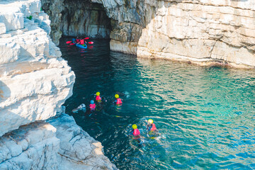 people swimming to grotto cave in sea famous landmark