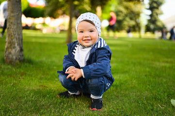 portrait of a child playing on the street in a hat