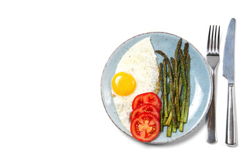 Healthy homemade breakfast with asparagus, fried egg and arugula. quarantine healthy eating...