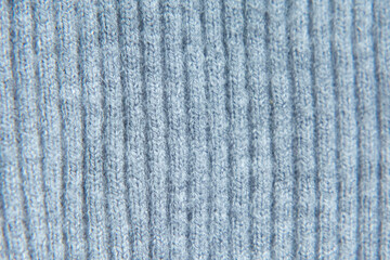 Grey knitted fabric texture abstract background. parallel knitting