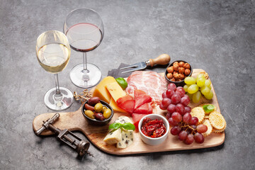 Cheese, meat, grapes and olives antipasto