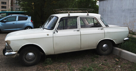 Old soviet car. Grunge car. White car.