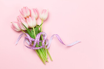 Pink tulips over pink background