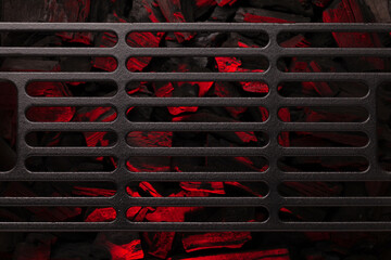Metal barbecue grill over hot coal
