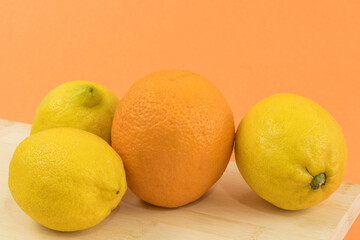Close up of an orange and three lemons,