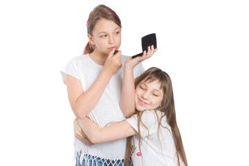 Two sisters, one embracing the other. Uses lipstick sloppily.