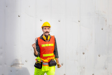 Engineer man in hard hat celebrating victory, foreman worker raise hands in celebration
