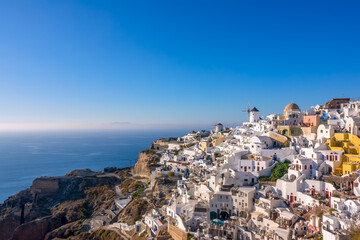 White Houses and Windmills on a Mountainside in Santorini