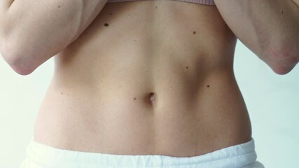 beautiful athletic belly. inflated muscles of female press.