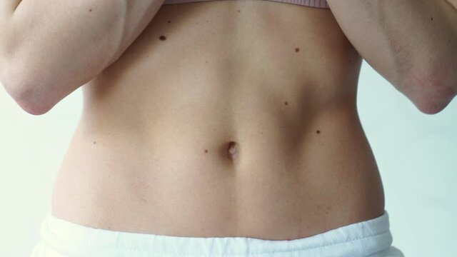 beautiful athletic belly. inflated muscles of female press.
