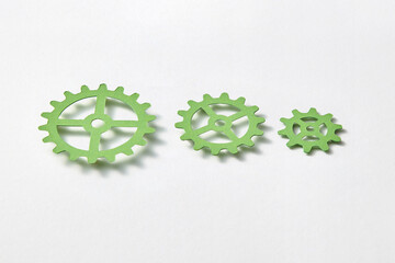 Papercraft clockwork different size with shadows on a white backgrond.