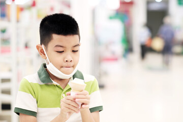 Boy eating ice cream cone