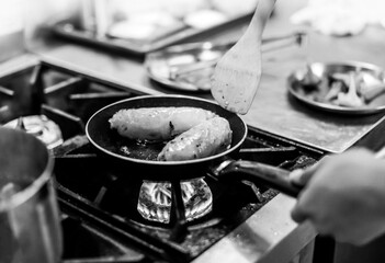 Chef cooking in a kitchen, chef at work, Black & White.