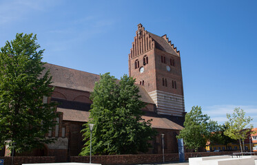 Old red church in k&oslash;ge with blue sky