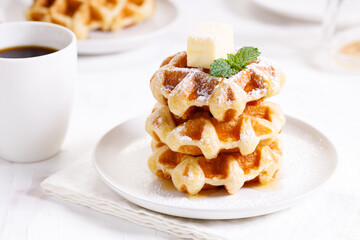 fresh baked waffles in a white plate