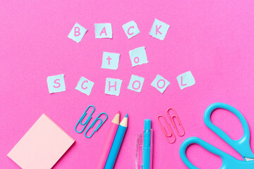 The stationery and the inscription back to school, pink background