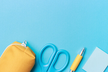 Stationery on blue background, copy space, concept back to school