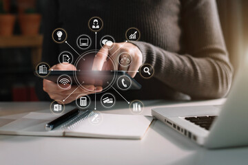 Female working with tablet and laptop and digital tablet computer.