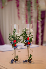 glasses with wedding decor and flowers