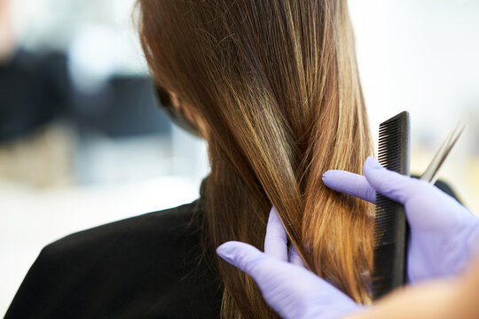 Adult Woman At Hairdresser Wearing Protective Mask Due To Coronavirus Pandemic