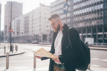 Man traveller using map - Traveller man sightseeing reading map planning destination