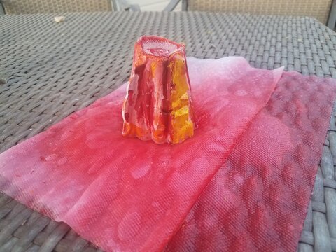 Plaster Volcano With Red Lava Erupting On Paper Towel