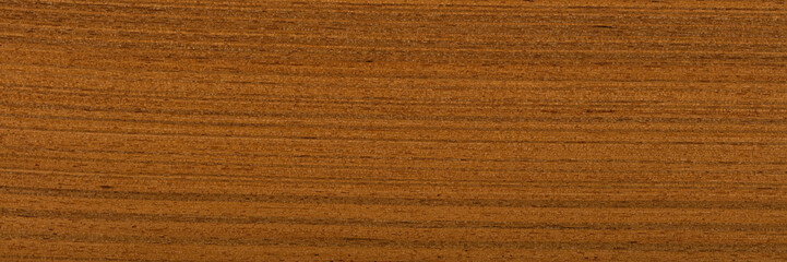 New teak veneer background in elegant dark brown color. Natural wood texture, pattern of a long veneer sheet, plank.