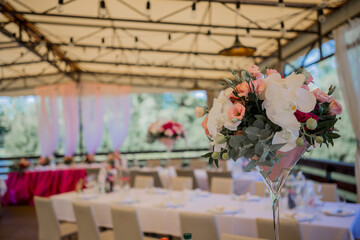 banquet table in a restaurant with flower decor