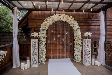 arch for a wedding ceremony of flowers in the park