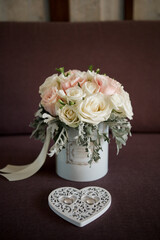 wedding rings with a bouquet of the bride