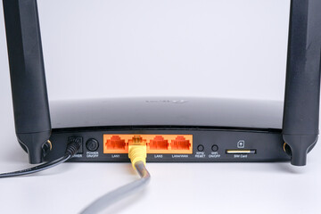 WiFi Modem Router ADSL connected with LAN RJ45 Cable. It is a LAN network connection ethernet...