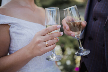 glasses with champagne in the hands at wedding