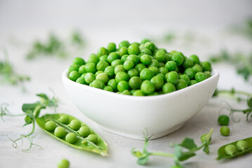 fresh green peas with greens and pea pods
